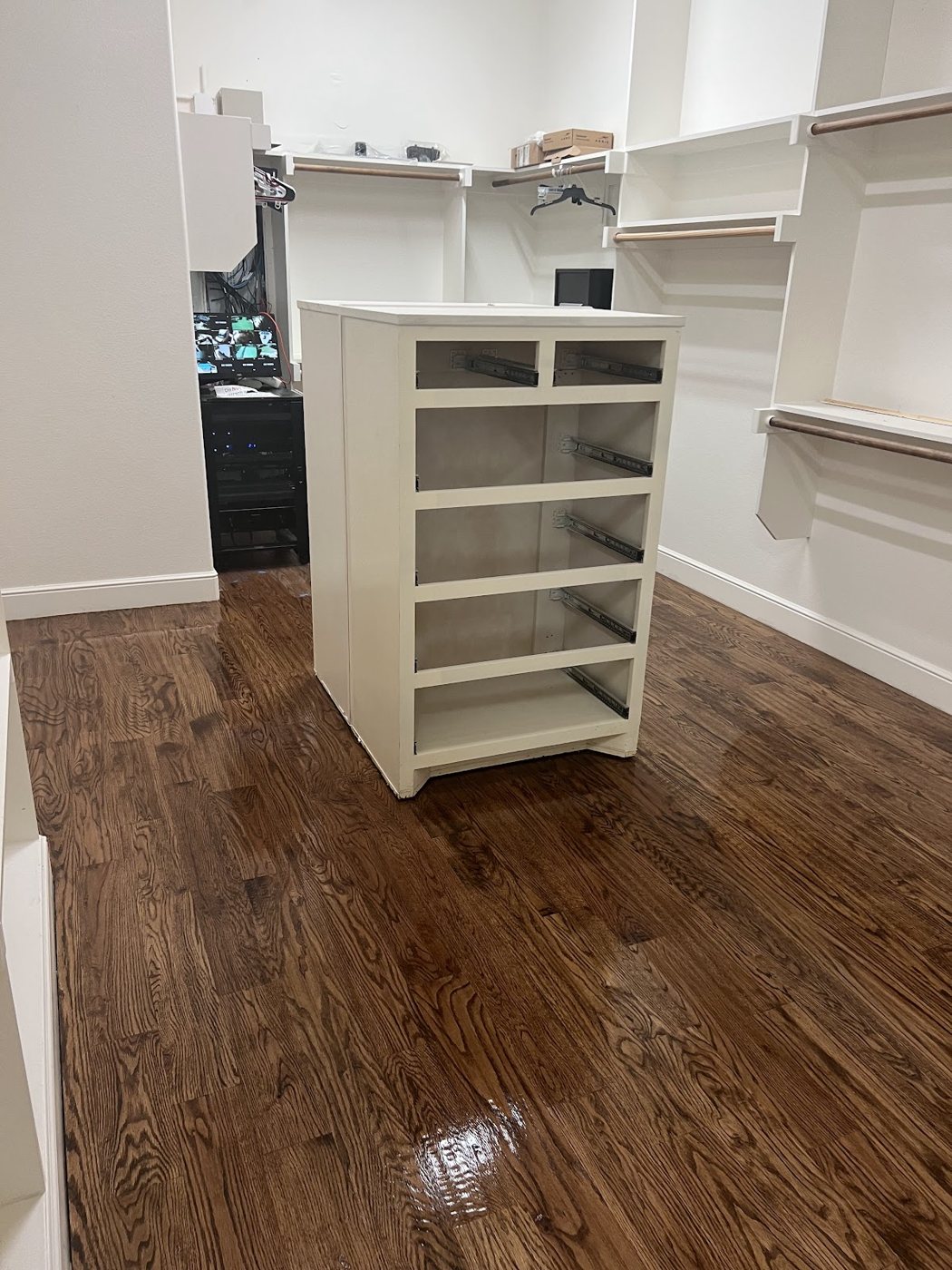 Glossy hardwood floor refreshed with a screen and recoat