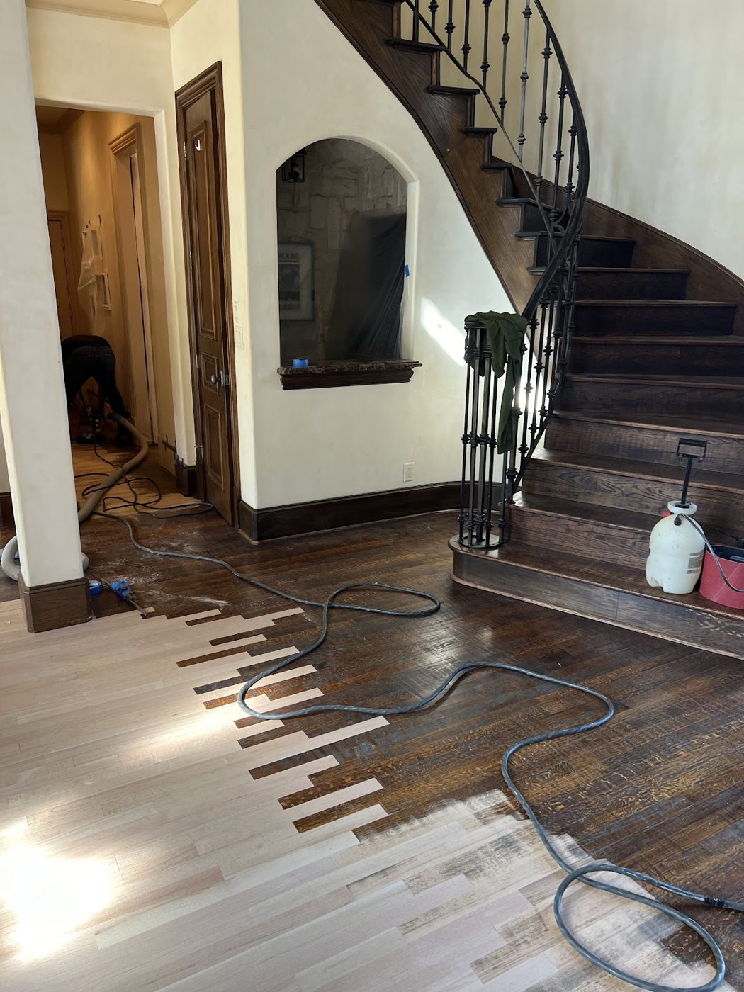 Hardwood floor repair in progress with damaged boards removed (hardwood floor repair in progress with equipment)